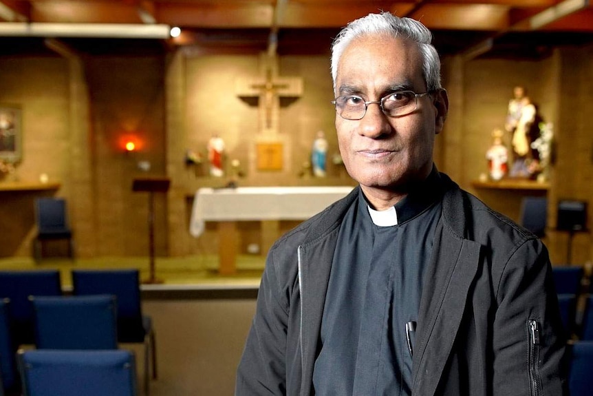 Father Albert Yogarajah pictured in a church.