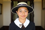 Year 9 student Alicia Goh, in her school uniform, poses for a photo.