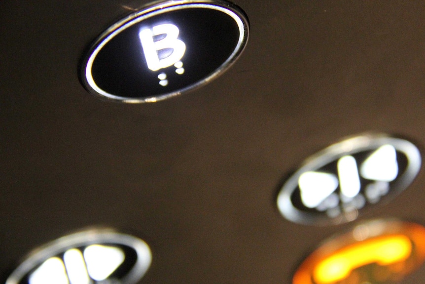 A close shot of a lift button.