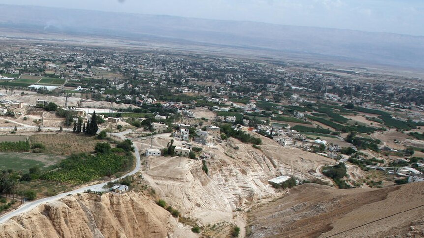 Tourists near Mount Temptation in Jericho