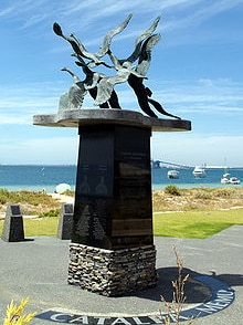 A memorial, featuring six wild geese flying west, on a beach in Rockingham in WA.