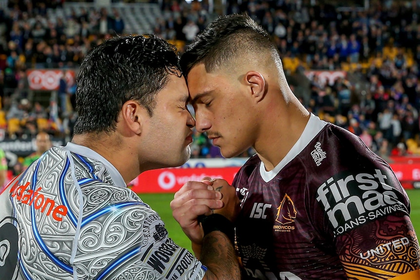 Two rugby league players engaging in a traditional greeting