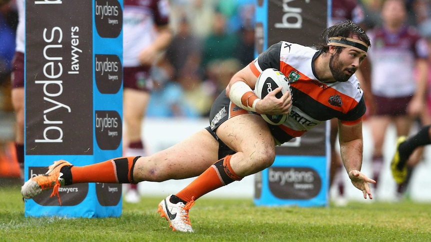 The Tigers' Aaron Woods scores a try against Manly at Leichhardt Oval on April 6, 2014.