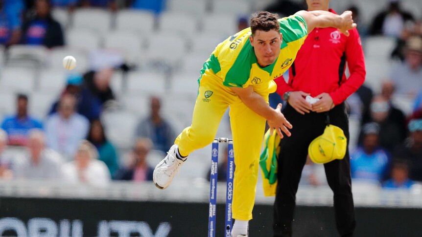 Marcus Stoinis looks down the pitch in his bowling stride