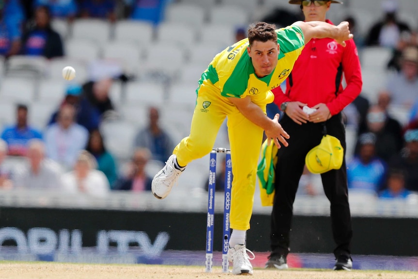 Marcus Stoinis looks down the pitch in his bowling stride