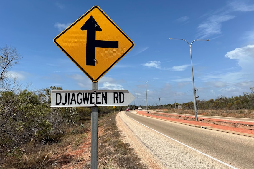 A road sign on the side reading Djiagween Road