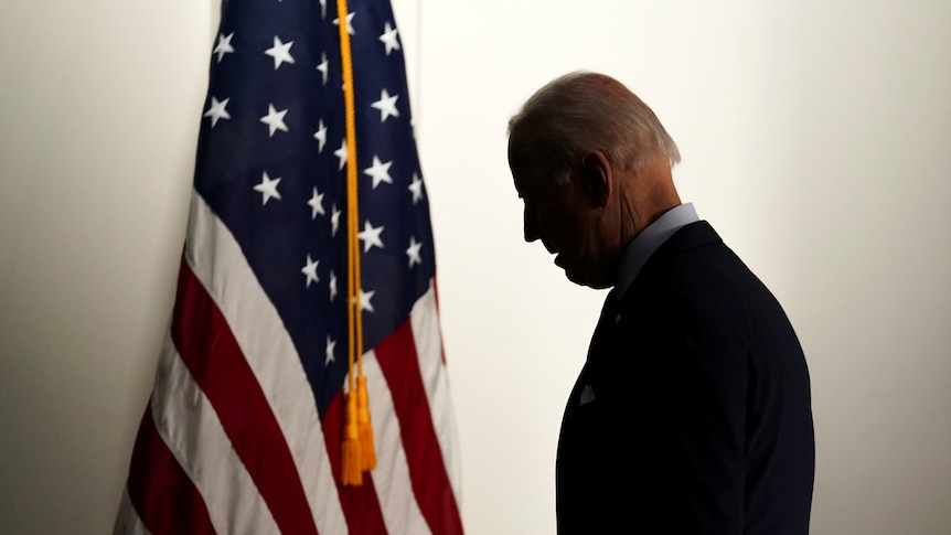Joe Biden with an American flag