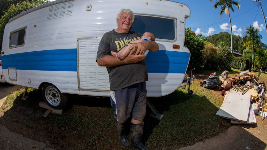 Burringbar resident Alastair Gibb with his grandson, Kalani, after terrifying floods.