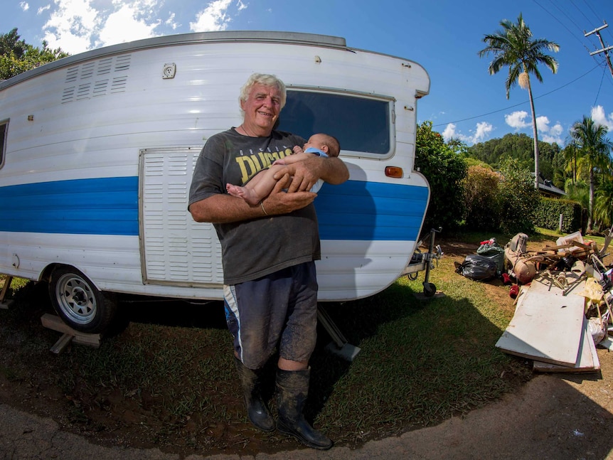 Burringbar resident Alastair Gibb with his grandson, Kalani, after terrifying floods.