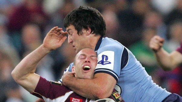 Darren Lockyer is tackled high