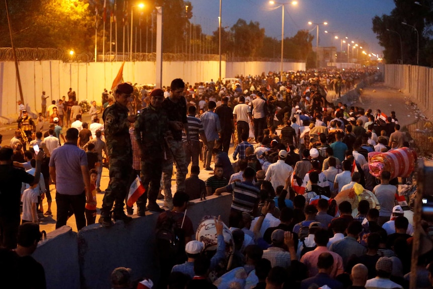 Protesters walk from the Green Zone in Baghdad.