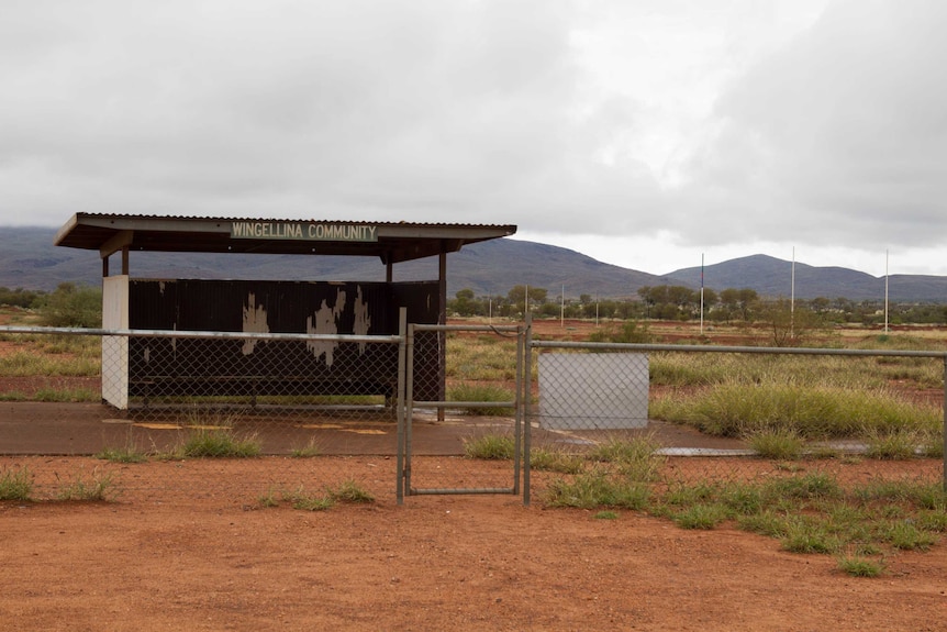 The tin shed and departure waiting area at the Wingellina airport, just next to the dirt footy oval.