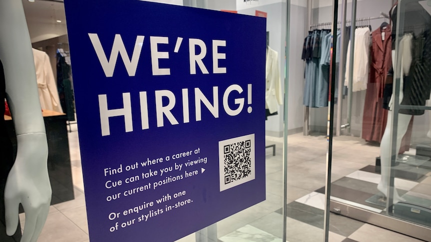 A clothing store in Sydney advertises for staff in its shopfront.