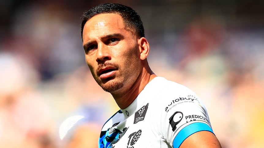 Corey Norman stands in a Toulouse Olympique rugby league jersey during a game.