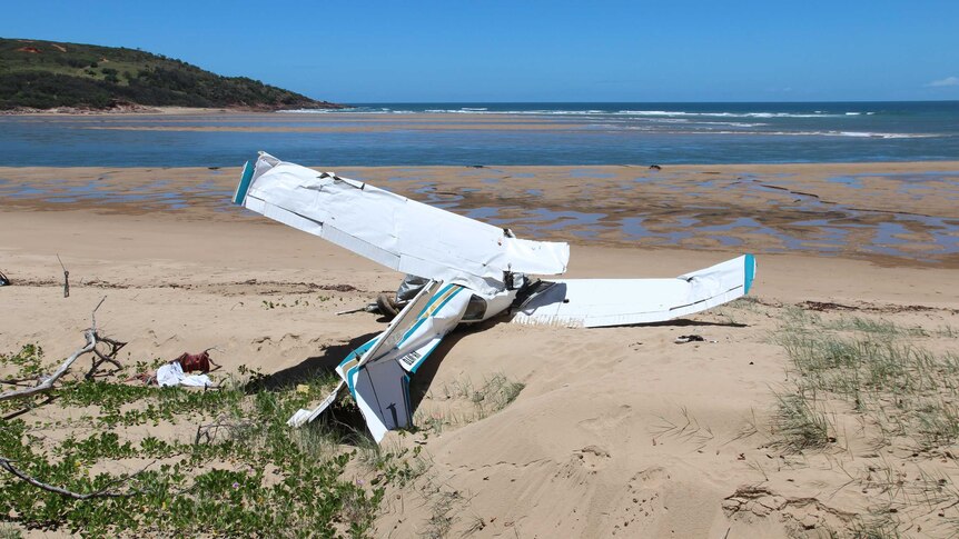 Twisted wreckage of the plane on the beach near Middle Island.