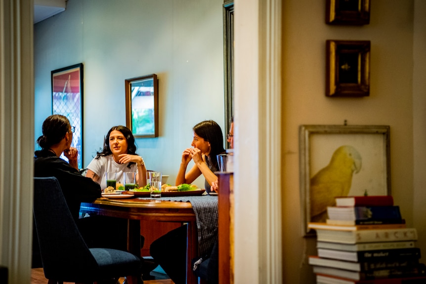 A family sitting around a table.