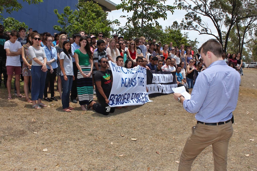 Angus Lane addresses the rally at JCU