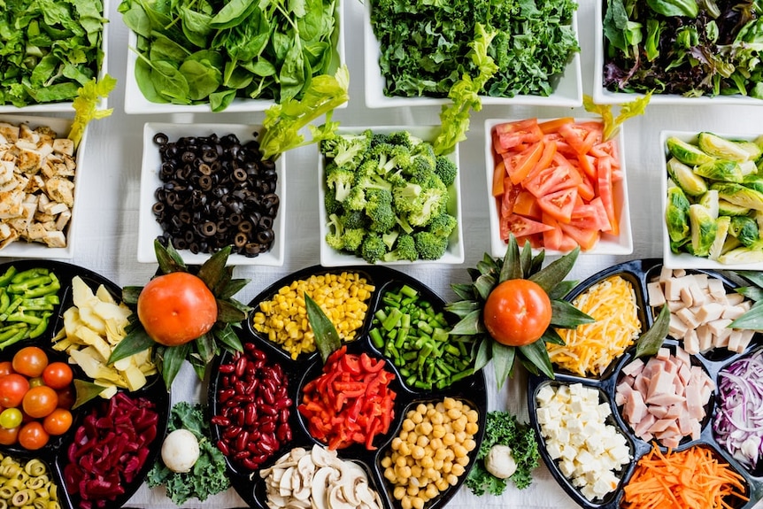 Bowls of chopped vegetables.