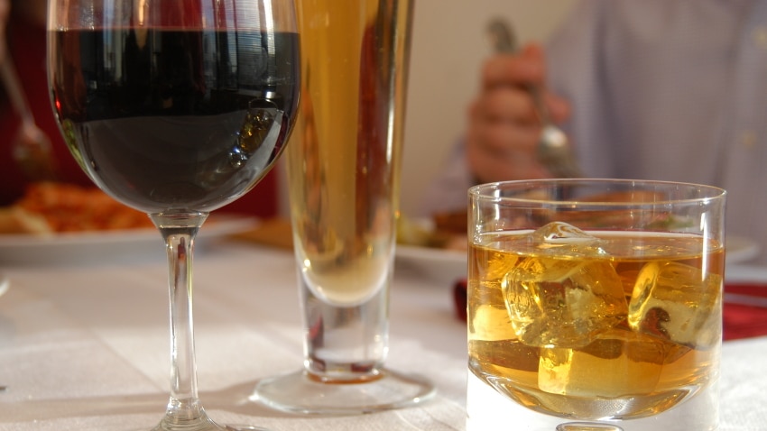 A variety of alcoholic beverages on a table.