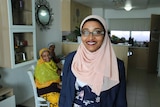 Hadia Komba with her mother and sister in her Flemington public housing flat in Melbourne.