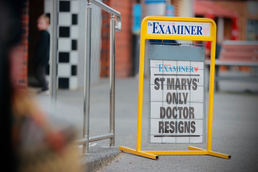 A newspaper sign on a footpath reads: St Marys' only doctor resigns