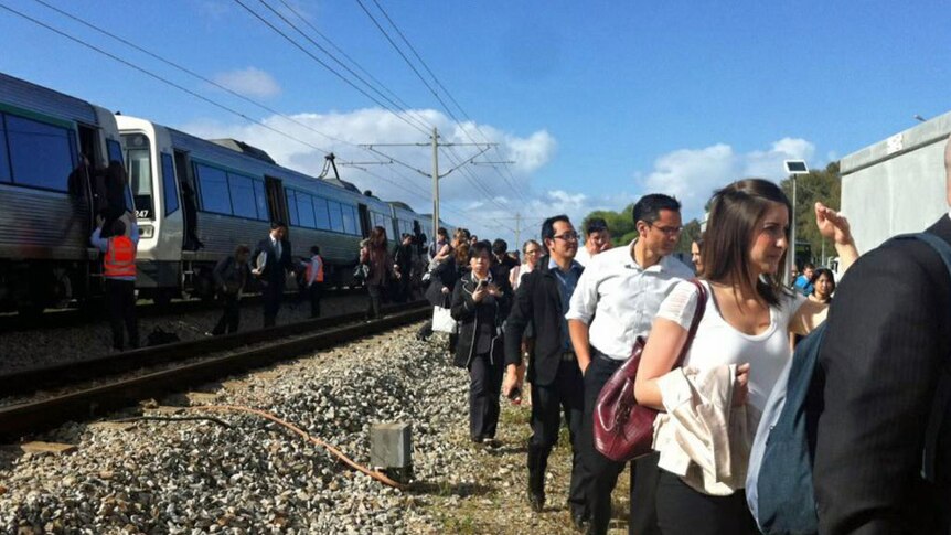 Commuters stranded as snapped cables hit train