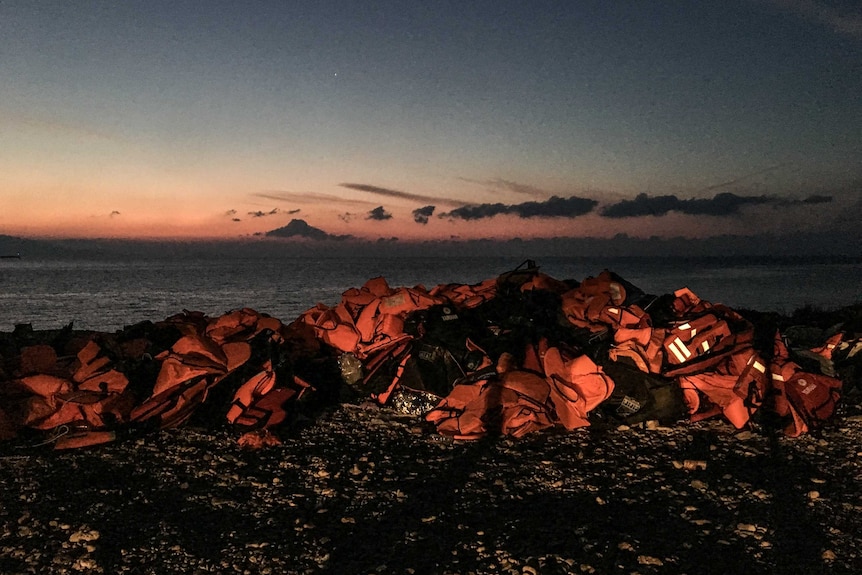 Life jackets worn by asylum seekers piled up on the Greek Island of Lesvos.