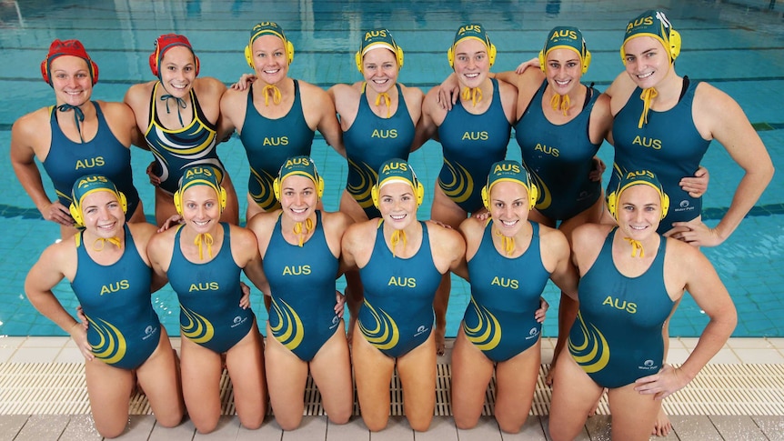 The Australian women's Olympic water polo team pose at Sydney Olympic Park Aquatic Centre.