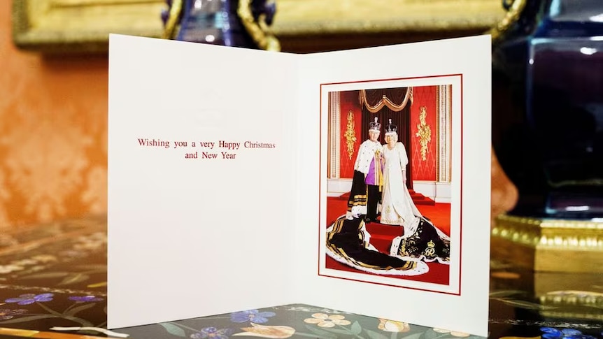 A card with a statement that reads Happy Christmas from King Charles and Queen Camilla