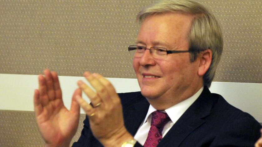 Kevin Rudd applauds during the Labor caucus meeting