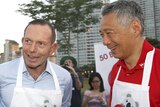 Tony Abbott at a barbecue with Lee Hsien Loong