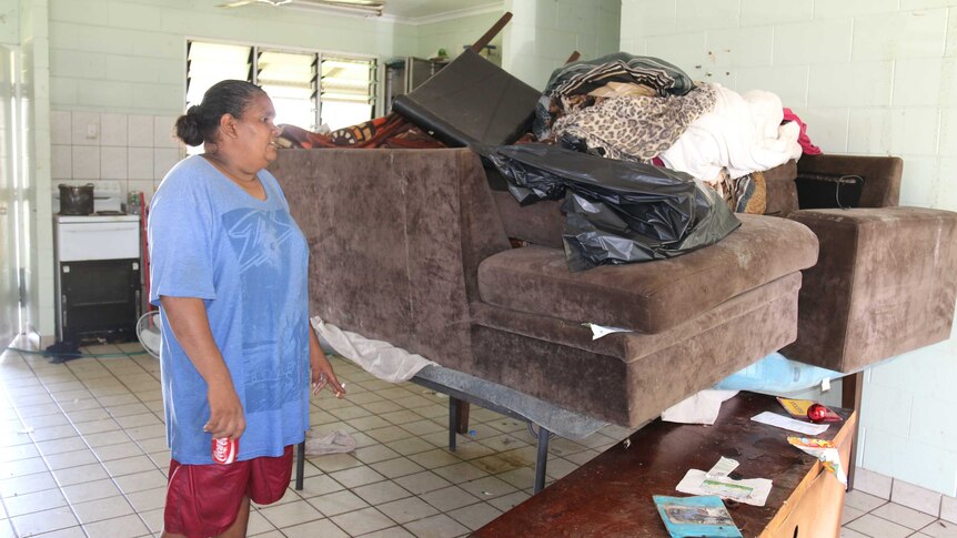 Nadine Daly looks at her possessions piled high