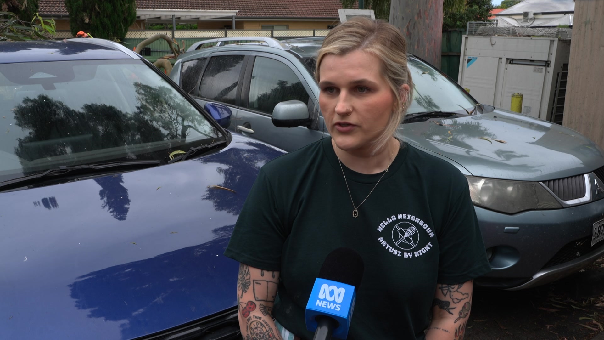 A woman speaks in front of an ABC mic