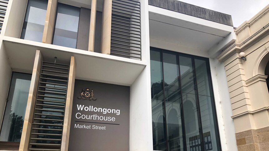 An exterior shot of the Wollongong Local Court building. A sign reads Wollongong Courthouse Market Street.