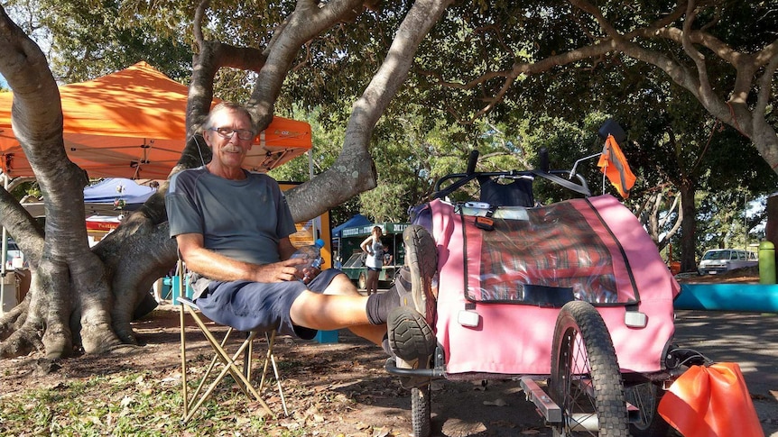 66 year old man from New Zealand rests his legs after walking from Port Augusta to Darwin