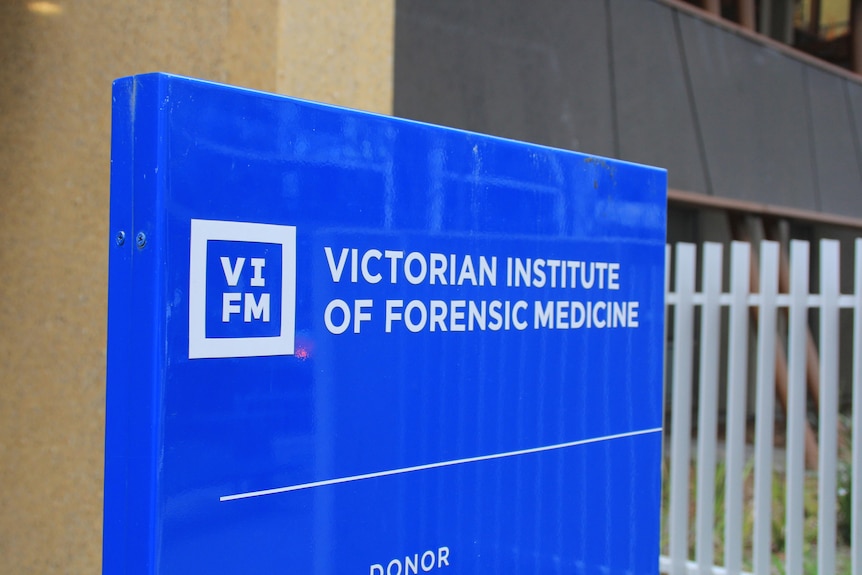 A blue sign at the entrance to the Victorian Institute of Forensic Medicine in Melbourne.