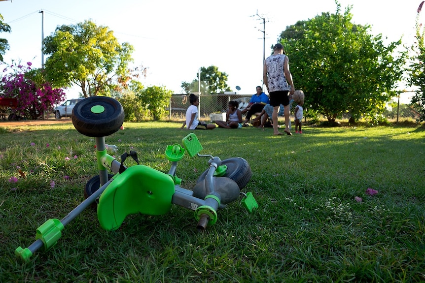 The Raggett family plays in their yard in Borroloola