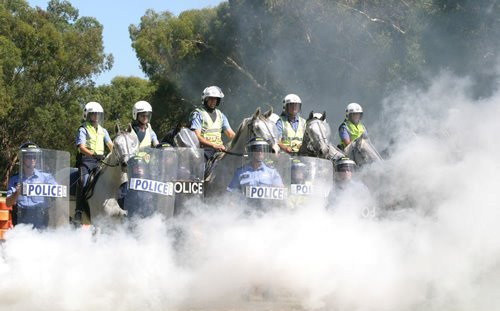 Police on horseback and with riot shields train for CHOGM