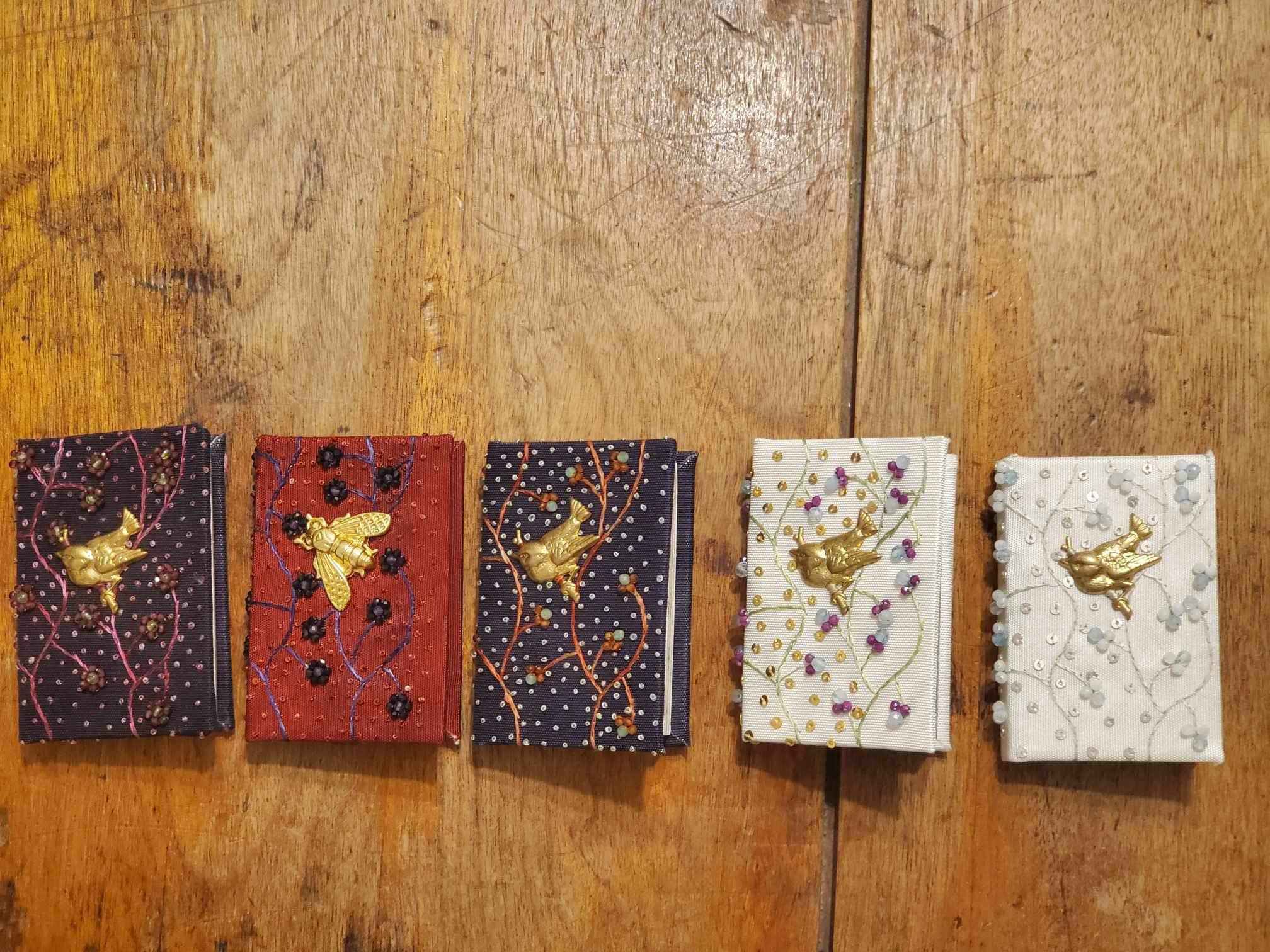 five jewelled miniature books with gold inlays 