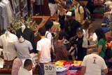 Crowds sort through garments at the Boxing Day sales