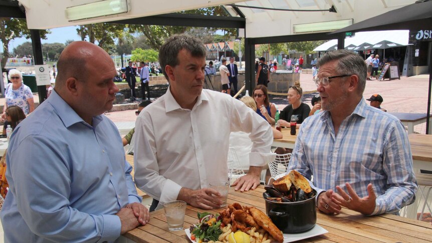 Fisheries Minister Dave Kelly, with AHA chief executive Bradley Woods and a Hillarys restaurant owner.