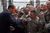 President Obama fist-bumps a U.S. soldier at Camp Victory in Baghdad