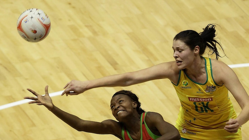 Tight tussle: Mwayi Kumwenda of Malawi (L) and Australia's Susan Fuhrmann compete for the ball.