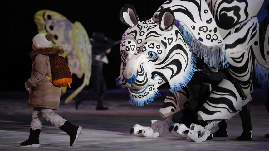 A large tiger puppet dancers at the opening of the Winter Olympics