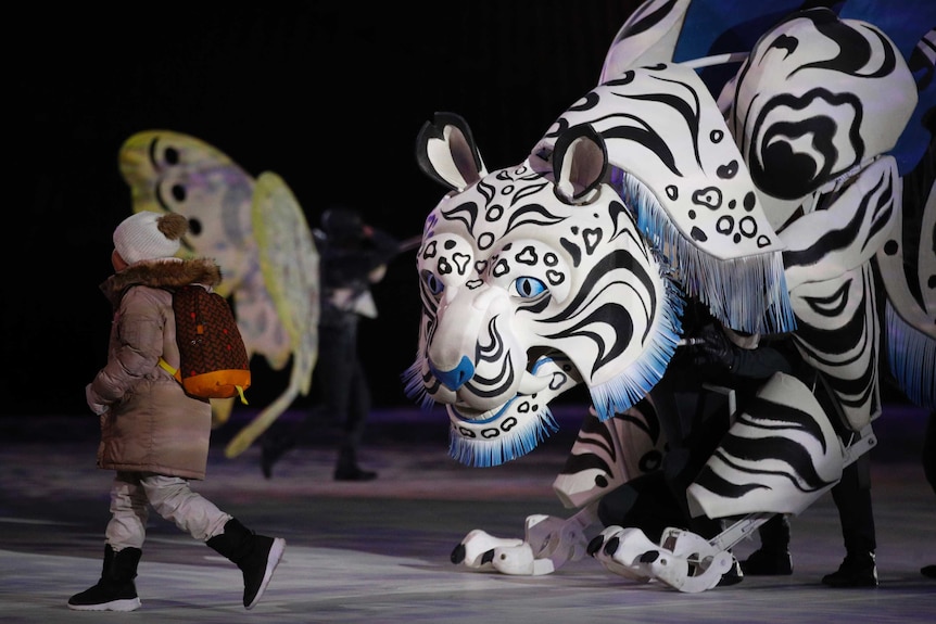 A large tiger puppet dancers at the opening of the Winter Olympics