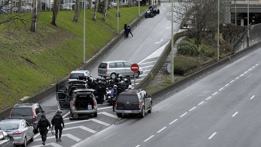 Members of the French police forces taking position by the kosher grocery store