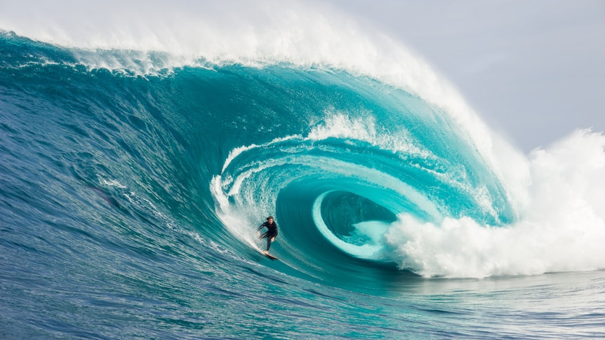 a surfer on a large wave