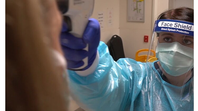 Nurses test patients at the Royal Melbourne Hospital COVID-19 Screening Clinic