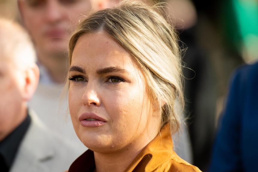 A woman speaks at a media conference