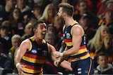 Adelaide Crows' Andy Otten celebrates a goal against St Kilda with team-mate Taylor Walker